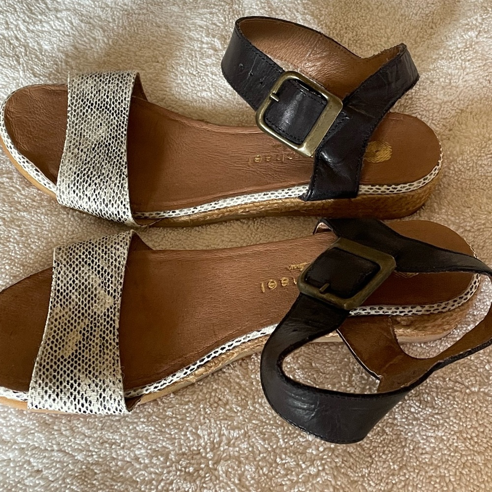 Eric Michael snake skin and black sandals with a tiny wedge. Guc